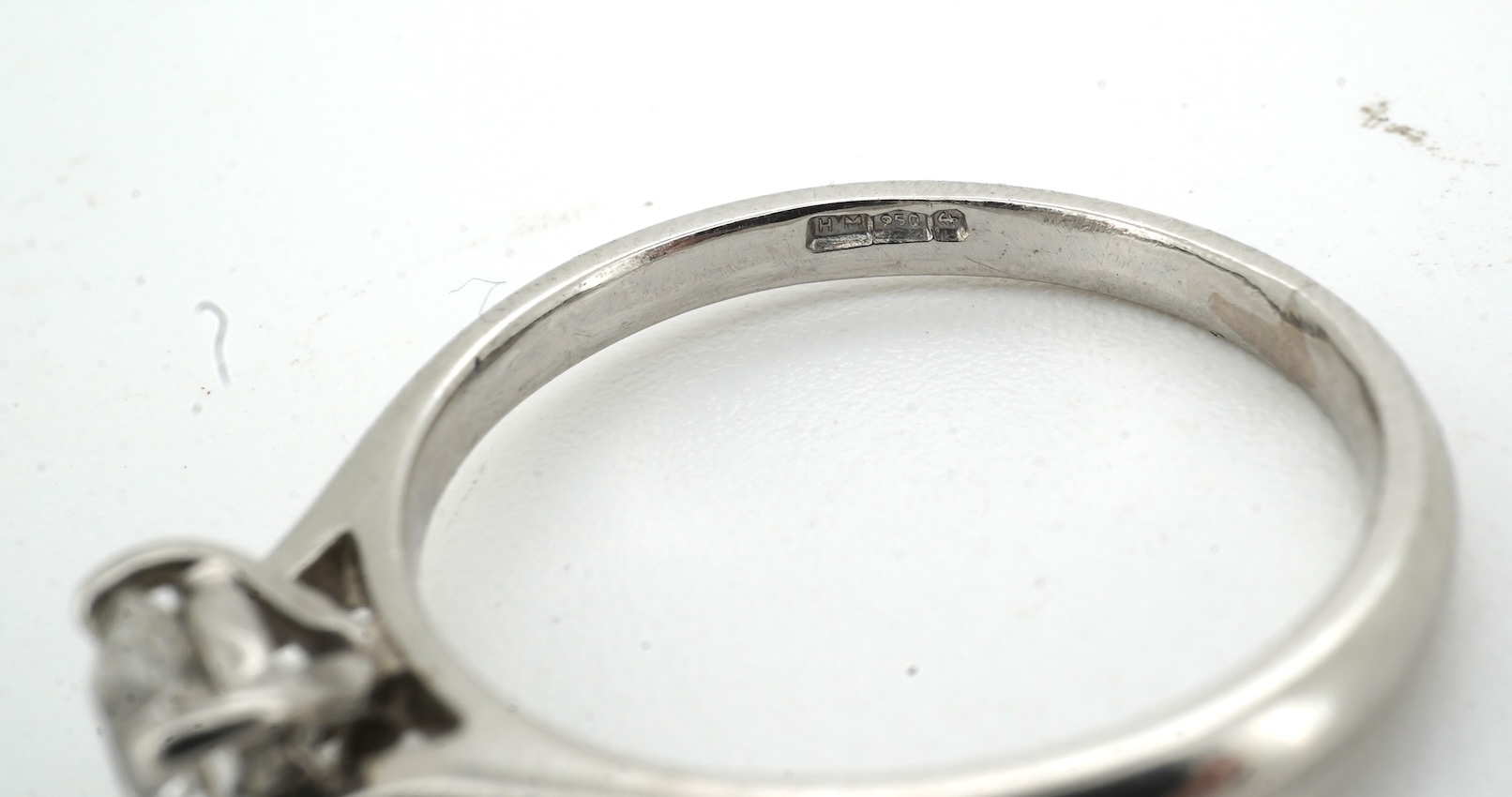 A diamond ring, claw-set with a brilliant-cut diamond weighing approximately 0.61 carats, mounted in platinum, size L, British hallmarks, gross weight approximately 3 grams